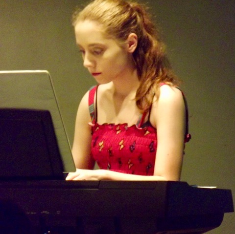 Emily playing a classical piece at an end of term concert